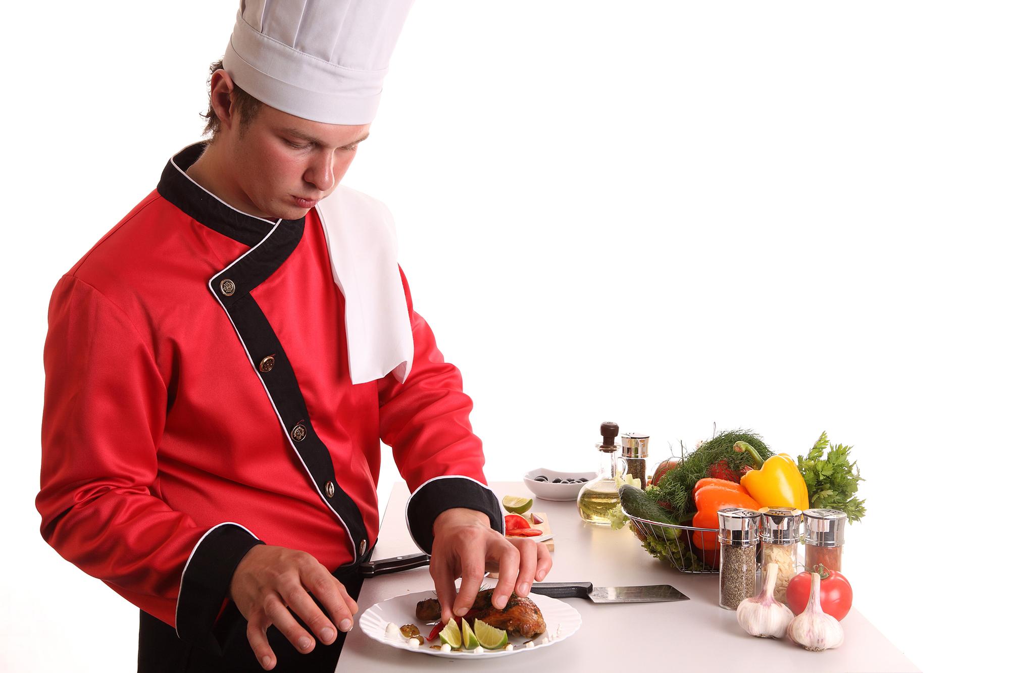 Chef preparing food in elegant kitchen studio